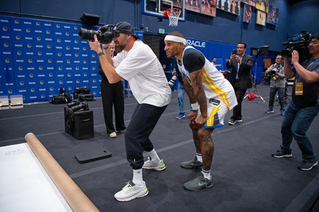 Golden State Warriors’ Gary Payton II (0) photography advice to team photographer Noah Graham during NBA Media Day at Chase Center in San Francisco, Calif., on Monday, Sept. 29, 2025. (Jose Carlos Fajardo/Bay Area News Group)