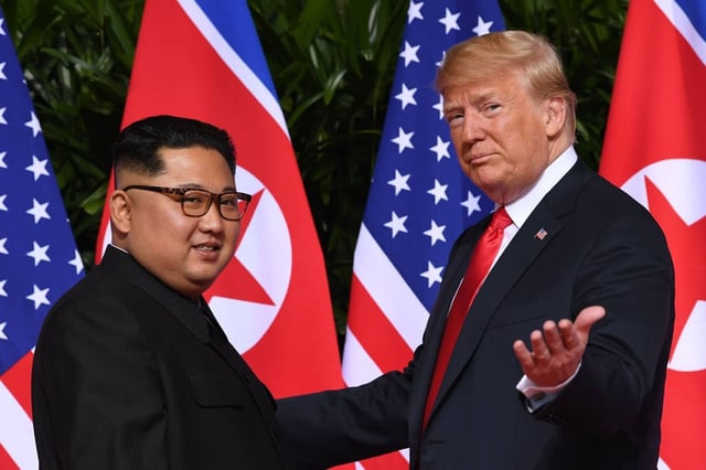 North Korea’s leader Kim Jong-un (left) with US President Donald Trump during their first summit in Singapore in June 2018. Photo: AFP