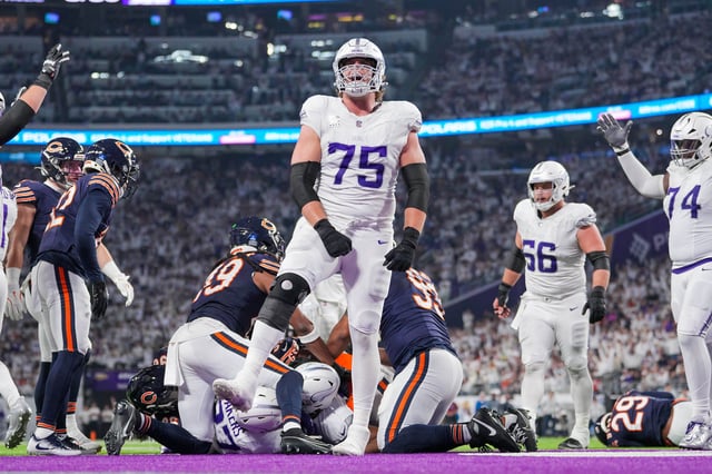 Dec 16, 2024; Minneapolis, Minnesota, USA; Minnesota Vikings offensive tackle Brian O'Neill (75) celebrates running back Cam Akers (27) touchdown against the Chicago Bears in the fourth quarter at U.S. Bank Stadium. Mandatory Credit: Brad Rempel-Imagn Images/ File Photo
