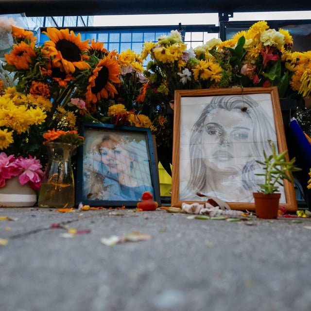 Flowers and photos are left near the tracks where Iryna Zarutska, who was fatally stabbed on a commuter train last month, Monday, Sept. 22, 2025, in Charlotte, N.C. (AP Photo/Nell Redmond)