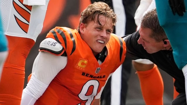 Cincinnati Bengals quarterback Joe Burrow grimaces after a sack.