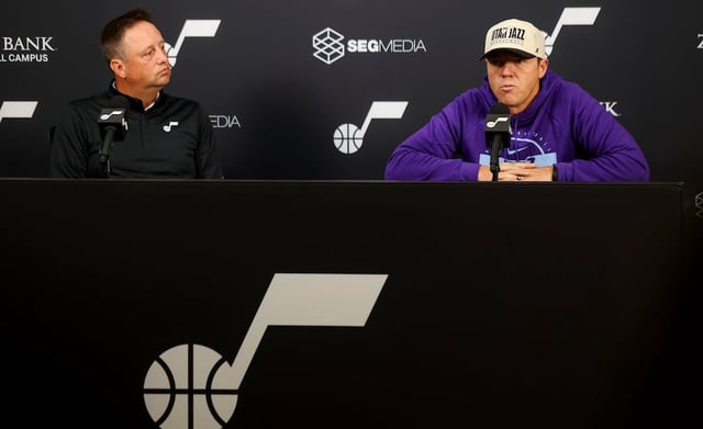 Austin Ainge, president of basketball operations, left, and Ryan Smith, chairman and CEO of Smith Entertainment Group and governor of the Utah Jazz, right, speak to media during the Utah Jazz media day at the Zions Bank Basketball Campus in Salt Lake City on Monday, Sept. 29, 2025.