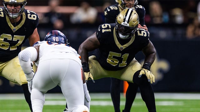 Aug 23, 2025; New Orleans, Louisiana, USA; New Orleans Saints center Cesar Ruiz (51) blocks Denver Broncos defensive end John Franklin-Myers (98) during the first half at Caesars Superdome. Mandatory Credit: Stephen Lew-Imagn Images.