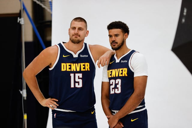 Sep 29, 2025; Denver, CO, USA; Denver Nuggets players Nikola Jokic (15) and Cam Johnson (23) pose for a picture during media day at Ball Arena. Mandatory Credit: Isaiah J. Downing-Imagn Images