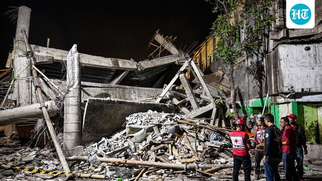Rescue personnel inspect the site after a building collapsed at an Islamic boarding school in Sidoarjo, East Java province on September 29, 2025.