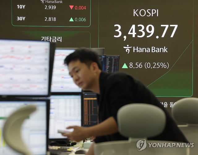 A person is seen working inside the dealing room of Hana Bank in central Seoul on Sept. 30, 2025. (Yonhap)