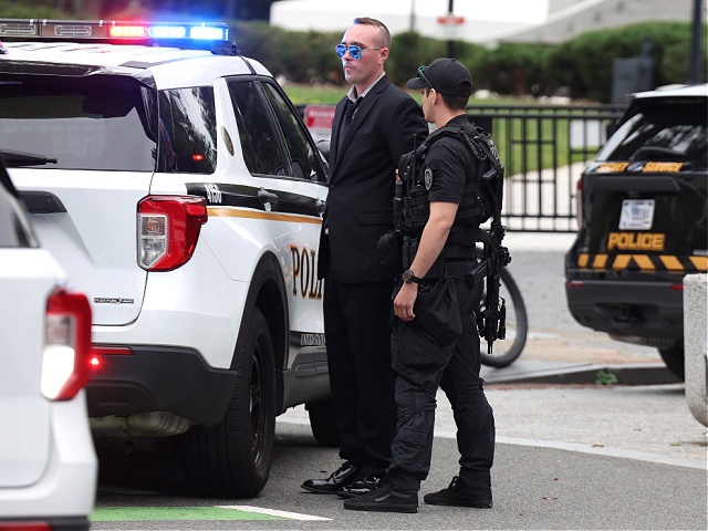 WASHINGTON, DC - SEPTEMBER 29: Members of the U.S. Secret Service detain an individual after they scaled the fence at the White House complex on September 29, 2025 in Washington, DC. Protesters gathered at the White House to demonstrate against the visit of Israeli Prime Minister Benjamin Netanyahu. (Photo by Tasos Katopodis/Getty Images)