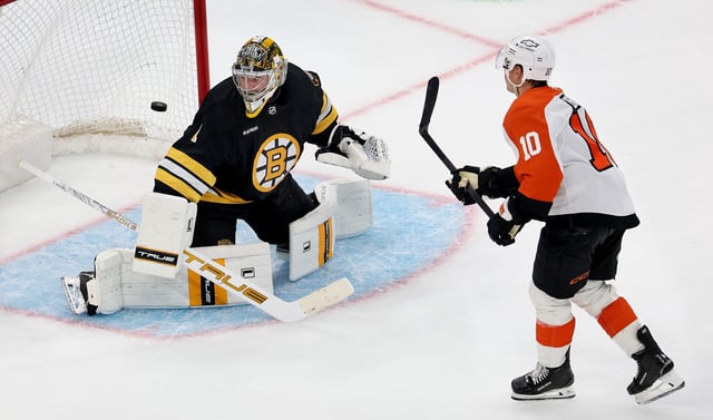 The Flyers' Bobby Brink beats Bruins goalie Jeremy Swayman for the winning goal in the shootout.
