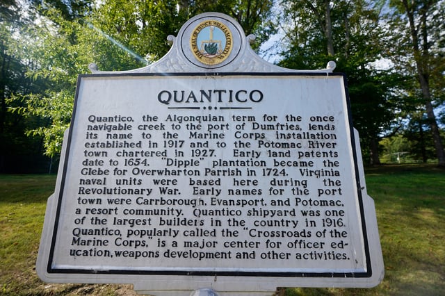 A historical marker is pictured at the entrance of Marine Base Quantico, Friday Sep. 26, 2025, in Quantico, Va. (AP Photo/Steve Helber)