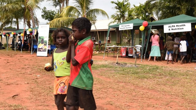 The Milingimbi community and work fair in 2015, where Senator Scullion launched the federal government's Community Development Program. (AAP Image/Dean Lewins)