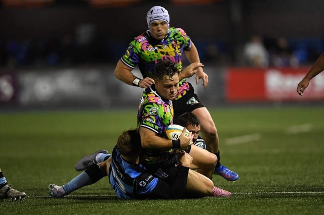 Lions fullback Quan Horn of Lions is tackled by Cardiff's Jacob Beetham with centre Henco van Wyk in support, during the URC match between the teams over the past weekend. Picture: Kian Abdullah/Gallo Images