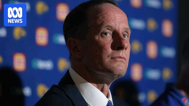 Don Pyke in a suit jacket, looking at the camera.
