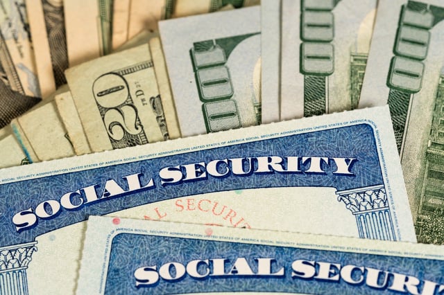 Stock image/file photo: A Social Security card with U.S. Dollars.