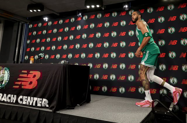 Boston Celtics forward Jayson Tatum approaches the microphone to address the media during the Celtics Media Day, Monday, at the Auerbach Center in Boston. (Mark Stockwell/Boston Herald)
