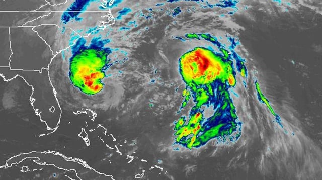 This infrared satellite image shows Tropical Storm Imelda at left and Hurricane Humberto on Tuesday morning, Sept. 30, 2025. (NOAA/GOES-East)
