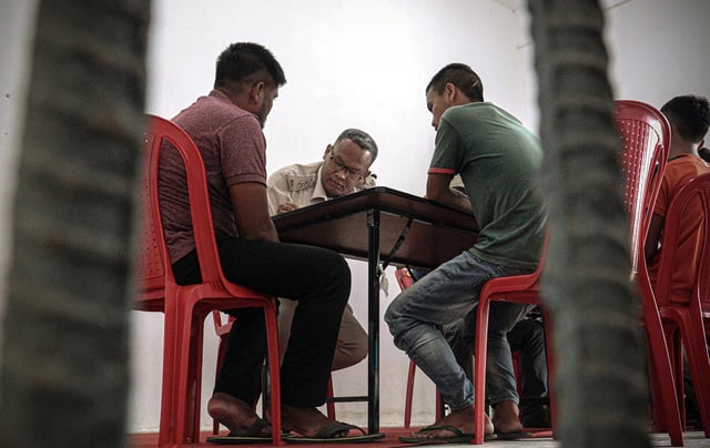 File photo of officials of Union Ministry of Home Affairs (MHA), National Crime Records Bureau and Manipur Home Department and Manipur Home Department collecting biometrics of illegal immigrants from Myanmar in view of the ethnic violence in the state, at the Foreigners Detention Centre, at Sajiwa, in Imphal East on Monday. (ANI Photo)