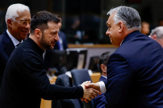Ukrainian President Volodymyr Zelenskiy shakes hands with Hungarian Prime Minister Viktor Orban at a European Union leaders' special summit to discuss Ukraine and European defence, in Brussels, Belgium March 6, 2025. REUTERS/Christian Hartmann/File Photo