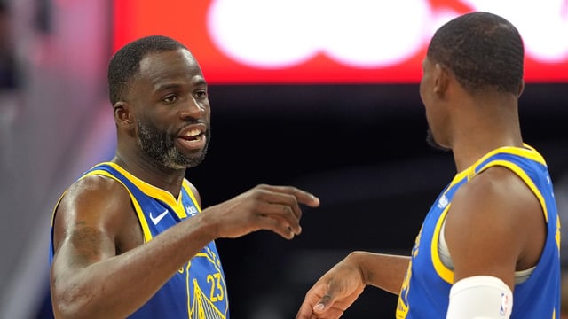Dec 25, 2024; San Francisco, California, USA; Golden State Warriors forward Draymond Green (23) talks with forward Jonathan Kuminga (right) during the third quarter against the Los Angeles Lakers at Chase Center. Mandatory Credit: Darren Yamashita-Imagn Images