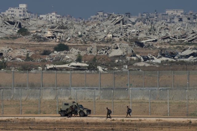 Israeli troops are seen near the Gaza Strip border in southern Israel, Tuesday, Sept. 30, 2025. (AP Photo/Ohad Zwigenberg)
