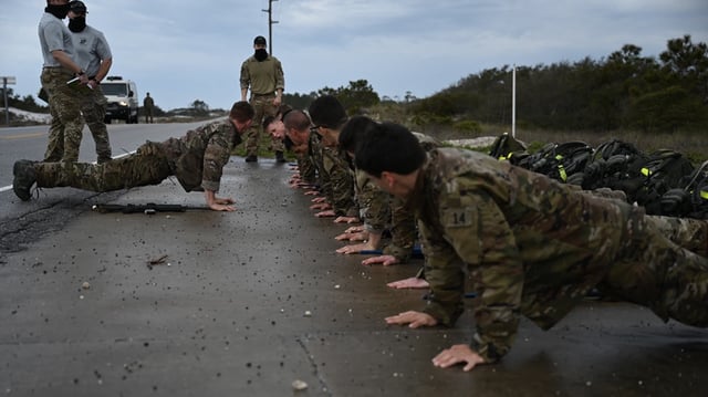 U.S. Air Force Special Tactics Officer and Combat Rescue Officer candidates perform pushups during an assessment and selection March 22, 2021 at Hurlburt Field, Florida.