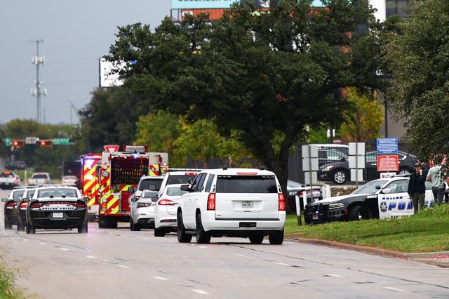 Law enforcement and emergency personnel respond near the scene of a shooting at a US Immigration and Customs Enforcement (ICE) detention facility in Dallas, Texas, on September 24, 2025.