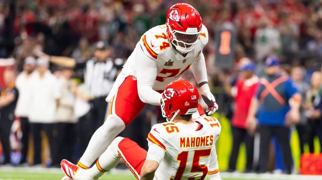 Feb 9, 2025; New Orleans, LA, USA; Kansas City Chiefs offensive tackle Jawaan Taylor (74) helps up quarterback Patrick Mahomes (15) against the Philadelphia Eagles in Super Bowl LIX at Ceasars Superdome. Mandatory Credit: Mark J. Rebilas-Imagn Images.
