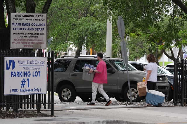 Republican Florida Gov. Ron DeSantis is proposing that President Donald Trump's presidential library be built in a parking lot that is currently used by Miami-Dade College staff and faculty and is adjacent to the Freedom Tower, Tuesday, Sept. 23, 2025, in Miami. (AP Photo/Marta Lavandier)