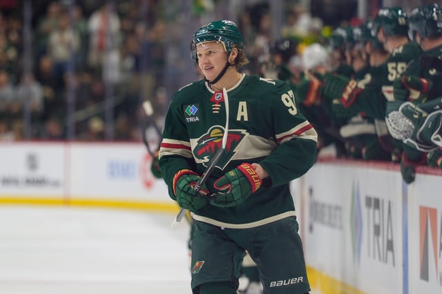 Sep 25, 2025; Saint Paul, Minnesota, USA; Minnesota Wild left wing Kirill Kaprizov (97) smiles as center Marco Rossi (23) scores the first goal of the game against the Dallas Stars in the first period at Grand Casino Arena. Mandatory Credit: Matt Blewett-Imagn Images