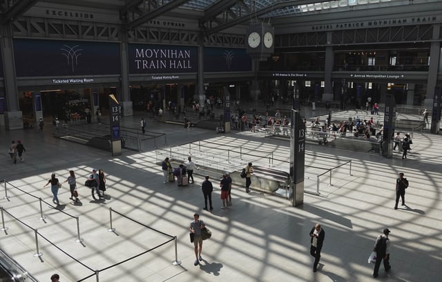 NEW YORK, NY - AUGUST 9: People walk through the Moynihan Train Hall at Penn Station on August 9, 2025, in New York City. (Photo by Gary Hershorn/Getty Images)