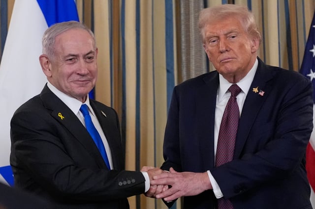 Israel's Prime Minister Benjamin Netanyahu shakes hands with President Donald Trump after a news conference in the State Dining Room of the White House, Monday, Sept. 29, 2025, in Washington. (AP Photo/Alex Brandon)