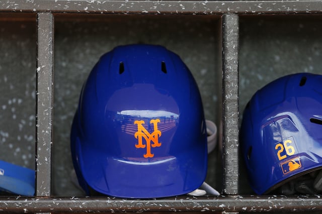 PORT ST. LUCIE, FL - MARCH 08: A New York Mets batting helmet in the dugout before a spring training baseball game against the Houston Astros at Clover Park on March 8, 2020 in Port St. Lucie, Florida. The Mets defeated the Astros 3-1.