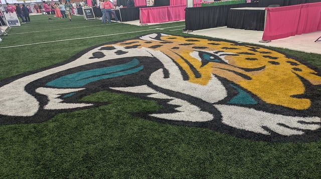 Donna Marathon Expo booths surround the Jacksonville Jaguars logo inside the Daily's Place flex field on Jan. 31, 2025. [Clayton Freeman/Florida Times-Union]