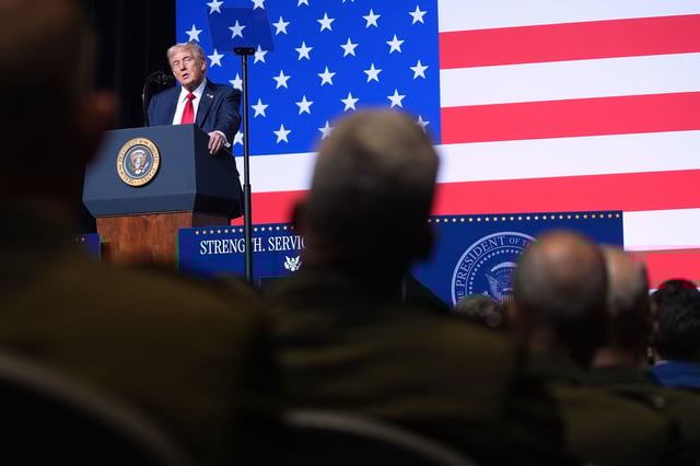 President Donald Trump speaks to a gathering of top U.S. military commanders at Marine Corps Base Quantico, Tuesday, Sept. 30, 2025, in Quantico, Va. (AP Photo/Evan Vucci)