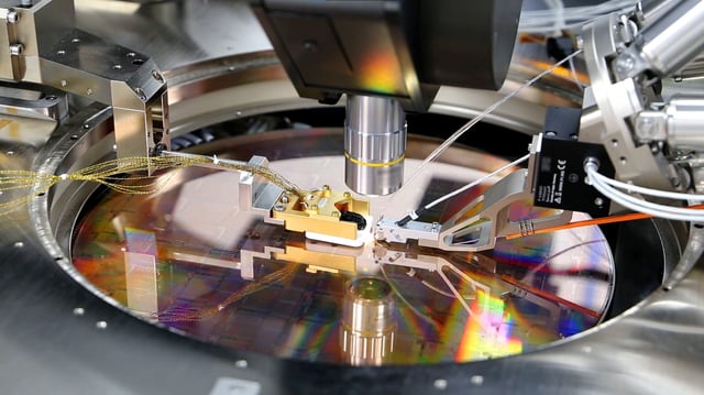 A view of a PsiQuantum Wafer, a silicon wafer containing thousands of quantum devices, including single-photon detectors, manufactured via PsiQuantum's partnership with GlobalFoundries in Palo Alto, California, U.S., in an undated photo taken in March 2021. PsiQuantum/Handout via REUTERS