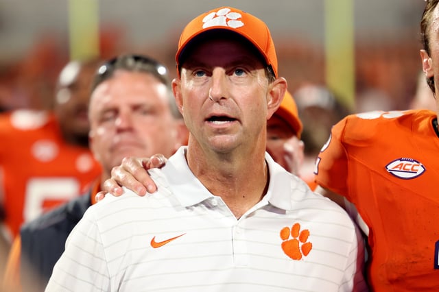 CLEMSON, SOUTH CAROLINA - SEPTEMBER 06: Dabo Swinney sings the Clemson Tigers anthem with his players to celebrate their 27-16 win against the Troy Trojans at Memorial Stadium on September 06, 2025 in Clemson, South Carolina. (Photo by Katie Januck/Getty Images)