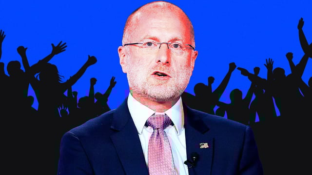 A photo illustration of Chairman of the Federal Communications Commission of the United States Brendan Carr and a rowdy crowd.