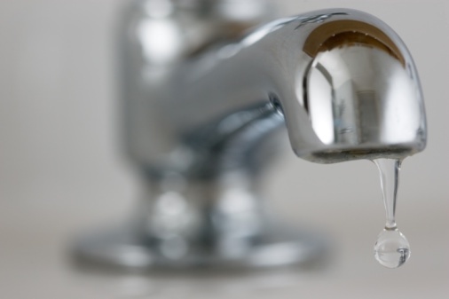 LONDON, UNITED KINGDOM – JANUARY 16:  Water drips from a domestic tap, United Kingdom.