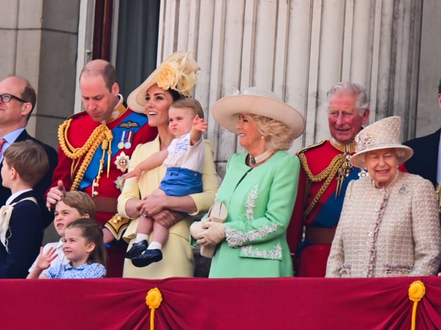 Members of the royal family on the balcony at Buckingham Palace including Queen Elizabeth, Prince William and Princess Kate, King Charles