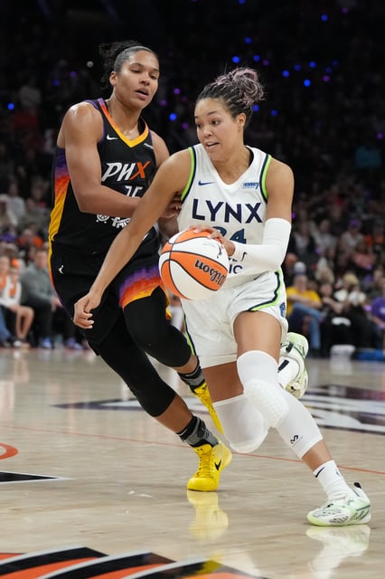 Lynx forward Napheesa Collier (24) drives on Phoenix Mercury forward Alyssa Thomas (25).