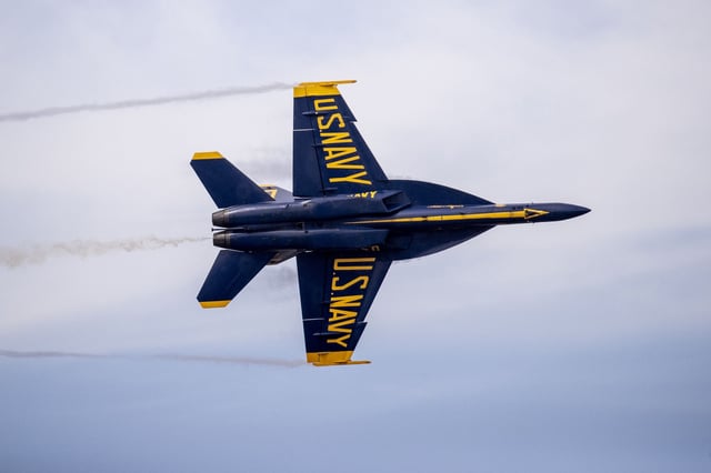 A F/A-18 Super Hornet belonging to the U.S. Navy Flight Demonstration Squadron, the Blue Angels, flies during a practice flight ahead of San Francisco Fleet Week, as seen from the Fairmont Hotel, in San Francisco, Oct. 10, 2024.