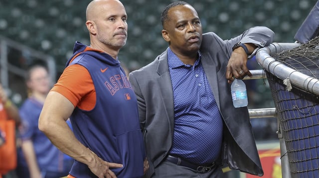 Jun 28, 2025; Houston, Texas, USA; Houston Astros manager Joe Espada (left) and general manager Dana Brown (right) talk on the field before the game against the Chicago Cubs at Daikin Park. Mandatory Credit: Troy Taormina-Imagn Images