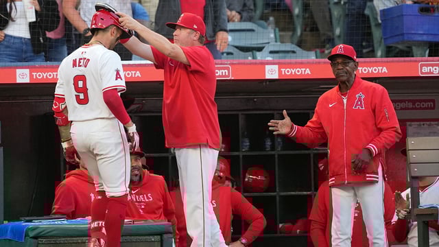 Jun 17, 2024; Anaheim, California, USA; Los Angeles Angels shortstop Zach Neto (9) is congratulated by bench coach Ray Montgomery (81) and manager Ron Washington after hitting a two-run home run in the fourth inning against the Milwaukee Brewers at Angel Stadium. Mandatory Credit: Kirby Lee-Imagn Images