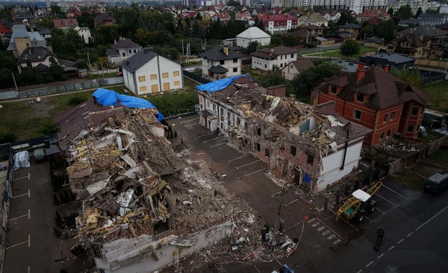 Residential houses are seen destroyed after a Russian strike in Kyiv, Ukraine, on Monday, Sept. 29, 2025.