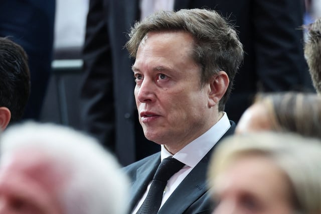Elon Musk attends the memorial service for political activist Charlie Kirk at State Farm Stadium on September 21, 2025 in Glendale, Arizona. © Photo by Win McNamee/Getty Images