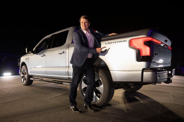 Jim Farley, CEO of Ford Motor Company, poses with the new all-electric F-150 Lightning performance truck at its reveal at Ford World Headquarters on May 19, 2021 in Dearborn, Michigan. The truck will be built at the all-new Ford Rouge Electric Vehicle Center in Dearborn starting in the Spring of 2022.