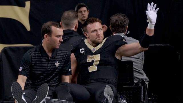 Dec 1, 2024; New Orleans, Louisiana, USA; New Orleans Saints tight end Taysom Hill (7) leaves the field after an injury against the Los Angeles Rams during the second half at Caesars Superdome. Mandatory Credit: Matthew Hinton-Imagn Images