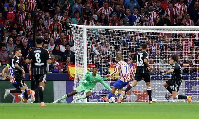 Soccer Football - UEFA Champions League - Atletico Madrid v Eintracht Frankfurt - Riyadh Air Metropolitano, Madrid, Spain - September 30, 2025 Atletico Madrid's Antoine Griezmann scores their third goal REUTERS/Juan Medina