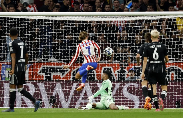 Soccer Football - UEFA Champions League - Atletico Madrid v Eintracht Frankfurt - Riyadh Air Metropolitano, Madrid, Spain - September 30, 2025 Atletico Madrid's Antoine Griezmann scores their fourth goal REUTERS/Susana Vera