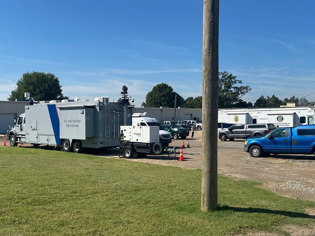 Mobile command centers for law enforcement sit at a staging area on Tuesday, Sept. 30, 2025, in Memphis, Tenn. (AP Photos/Adrian Sainz)