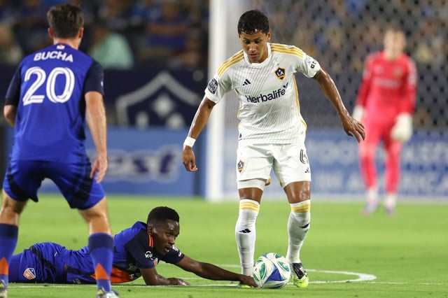 Galaxy midfielder Edwin Cerrillo, right, recovers the ball against FC Cincinnati during the first half Sept. 20, 2025, at Dignity Health Sports Park. (Photo by Raul Romero Jr., Contributing Photographer)